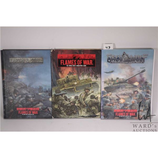 Three Flames of War hardcover gaming books including "Grey Wolf", "The World War II Miniatures Game"
