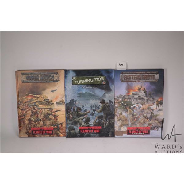 Three Flames of War hardcover gaming books including "Eastern Front", "Turning Tide" and "North Afri