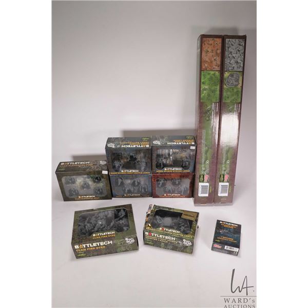 Selection of Battletech boxed paintable gaming figures and two Battlemats