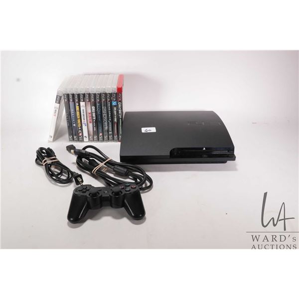 PS3 gaming system with cord and controller plus and thirteen assorted PS3 games plus one PS4 game. W