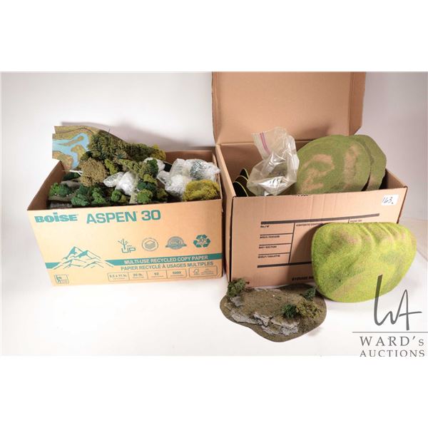 Two boxes containing a large selection of trees and terrain etc.