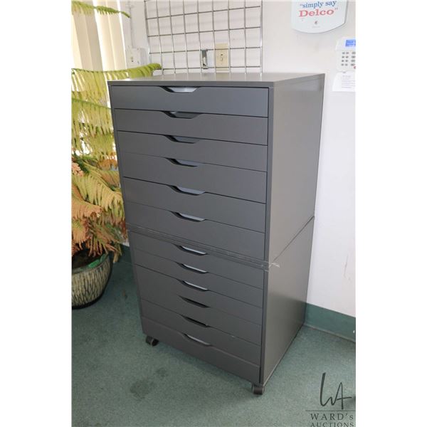 Two Ikea brand "Alex" six drawer storage cabinets, grey in colour, one of castors
