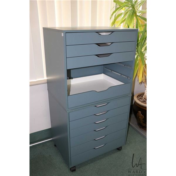 Two Ikea brand "Alex" six drawer storage cabinets, blue gray colour, one on castors, note: top cabin