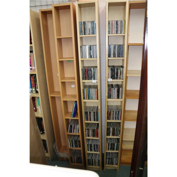 Four DVD and CD shelving units and contents of music CDs