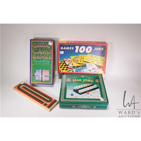 Four assorted games including American version Mah Jong, Great Card games book kit, box of 100 games