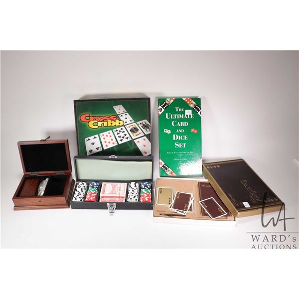 Four games including Cross Crib, Excellent crib set, The Ultimate Card and Dice set and an Encana po
