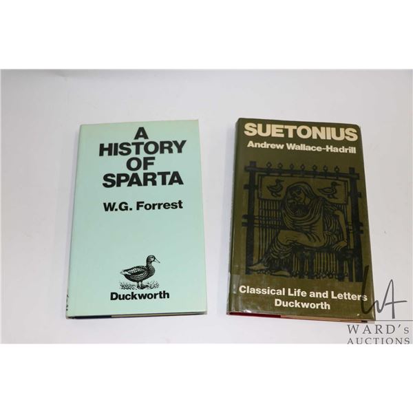 Two hardcover books including " Suetonius: The Scholar and his Caesars" by Andrew Wallace-Hadrill an