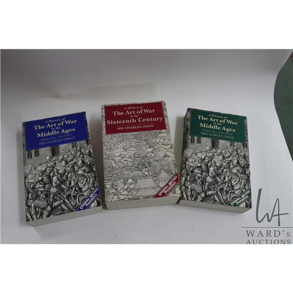 Three softcover books including "A History of The Art of War in the Middle Ages Volume I: 378-1278 A