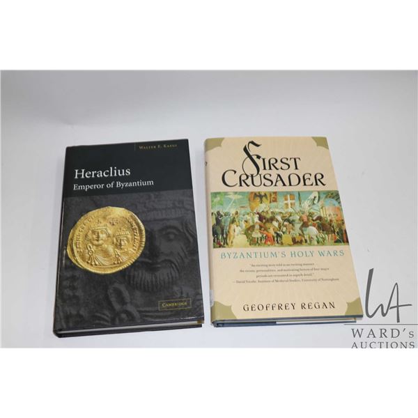 Two hardcover books including "First Crusader: Byzantium's Holy War" by Geoffrey Regan and "Heracliu