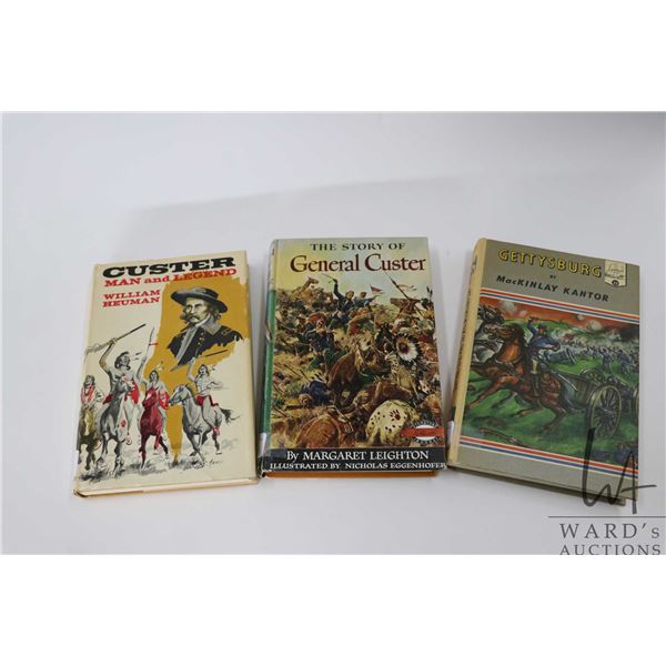 Three hardcover books including "Custer: Man and Legend" by William Heuman, " The Story of General C