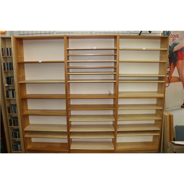 Three multi shelf bookcases each 79" X 31 1/2" X 10 1/2" plus extra shelves