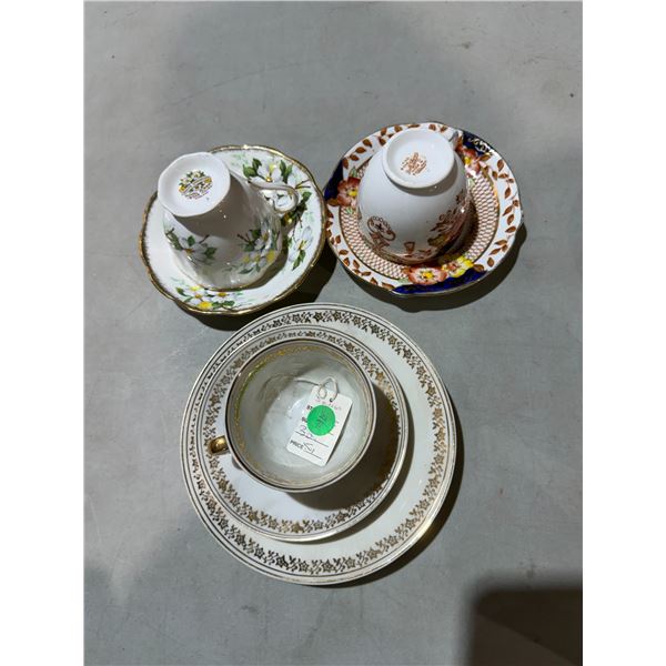 Assorted tea, cups, and saucers
