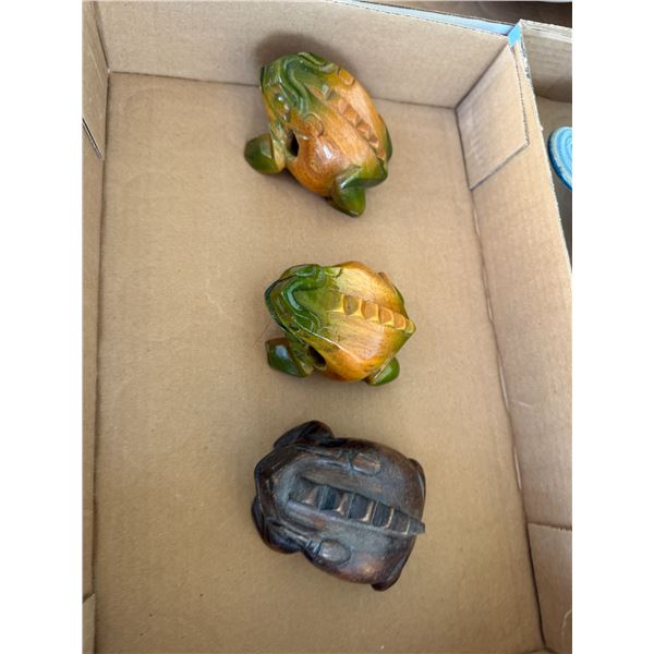 Carved frogs