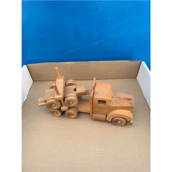 Wood carved logging truck