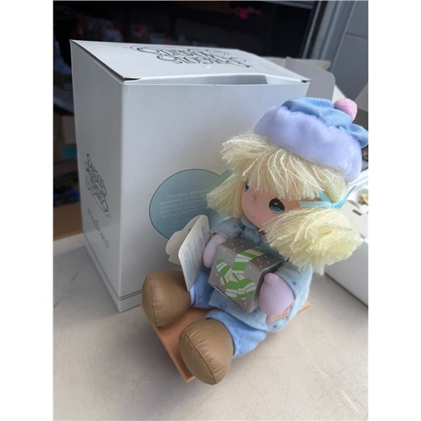 Precious moments doll on sled