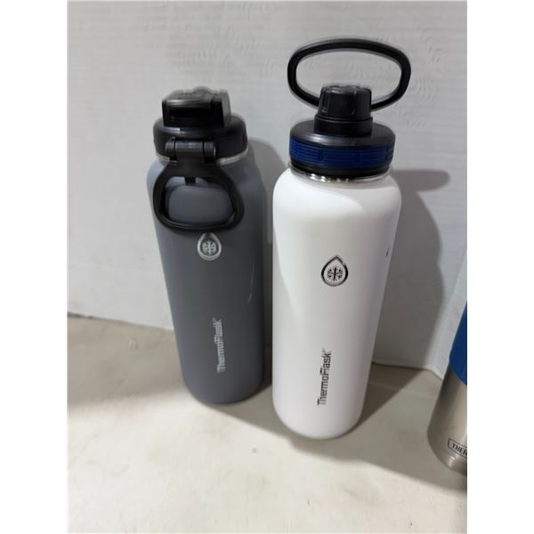Gray and white thermal flasks