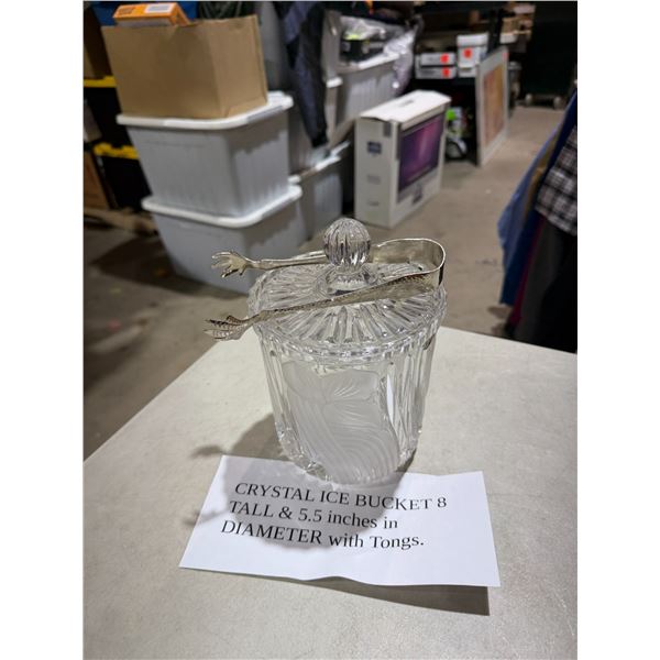 Crystal ice bucket 8 inches tall and 5 1/2 inches in diameter of tongs
