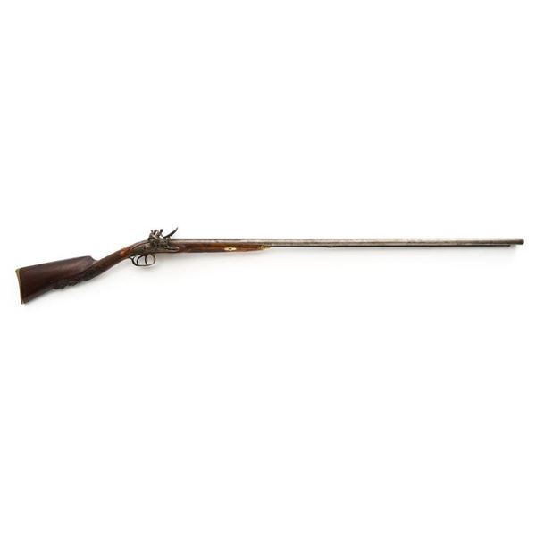 Elaborately Engraved 19th Century Belgian Flintlock Side-by-Side Shotgun, with Finely Carved Stock