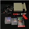 Image 1 : NINTENDO ENTERTAINMENT SYSTEM WITH CONTROLLERS, GUN AND GAMES