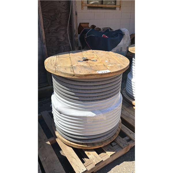 SPOOL OF WHITE PVC FLEXIBLE CONDUIT PIPE