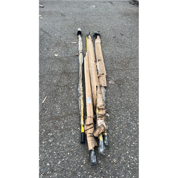 (4) LONG YELLOW UTILITY OR ELECTRICAL POLES