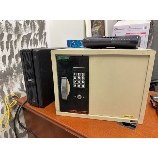 Brinks Home Security Safe, APC Back-UPS Pro 1500, and Router
