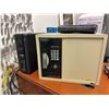 Image 1 : Brinks Home Security Safe, APC Back-UPS Pro 1500, and Router
