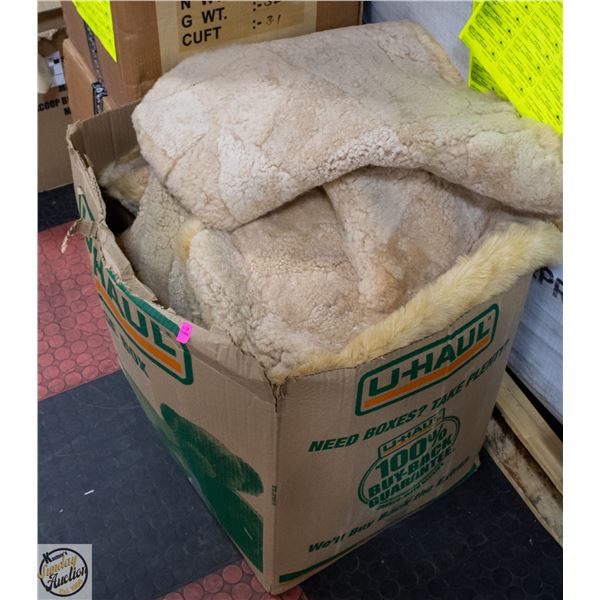 LARGE BOX OF SEAT COVERS - HAS MUSTY ODER
