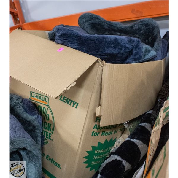 LARGE BOX OF SEAT COVERS - HAS MUSTY ODER