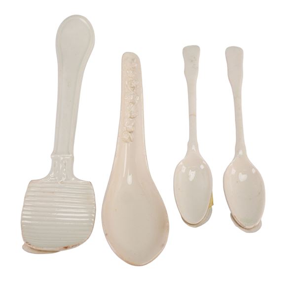 A 4pc Wedgwood Embossed Queen's Ware Butter Curler, Soup Spoon, and Two Teaspoons