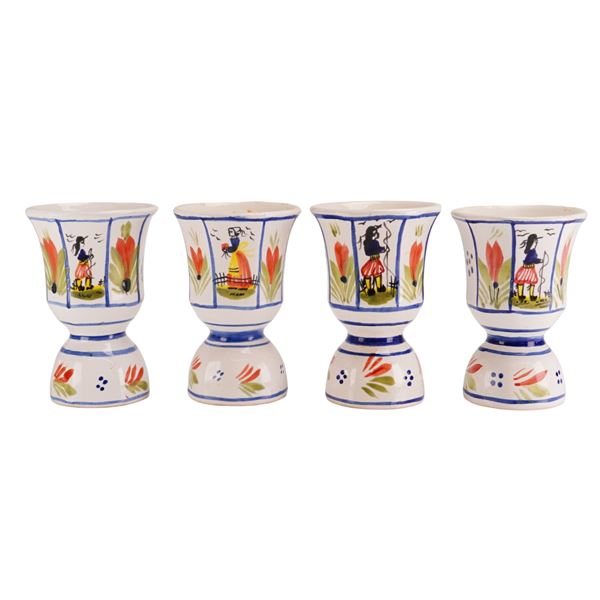 A Set of 4 HB Henriot Quimper Figural Decorated Faience Egg Cups