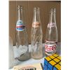 Image 3 : Pepsi Bottles, Rubik's Cube, Guide