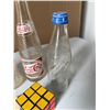 Image 4 : Pepsi Bottles, Rubik's Cube, Guide