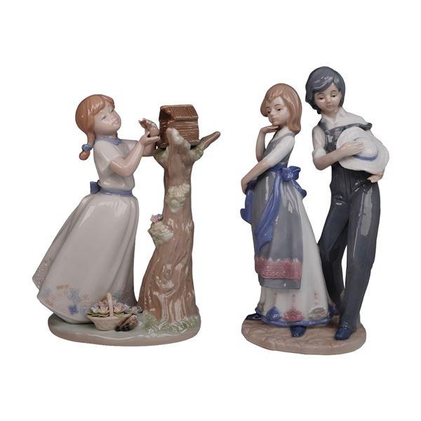 A Pair of  Glazed Ceramic Figurines, one by Nadal, depicting children