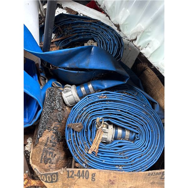 Several Blue Layflat Discharge Hoses with Coupler