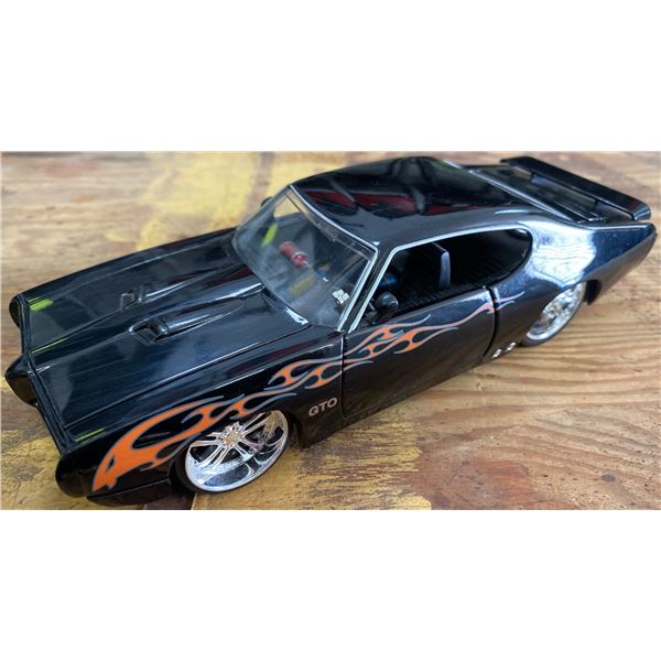 Bigtime Muscle 1969 Pontiac GTO Diecast Model Car