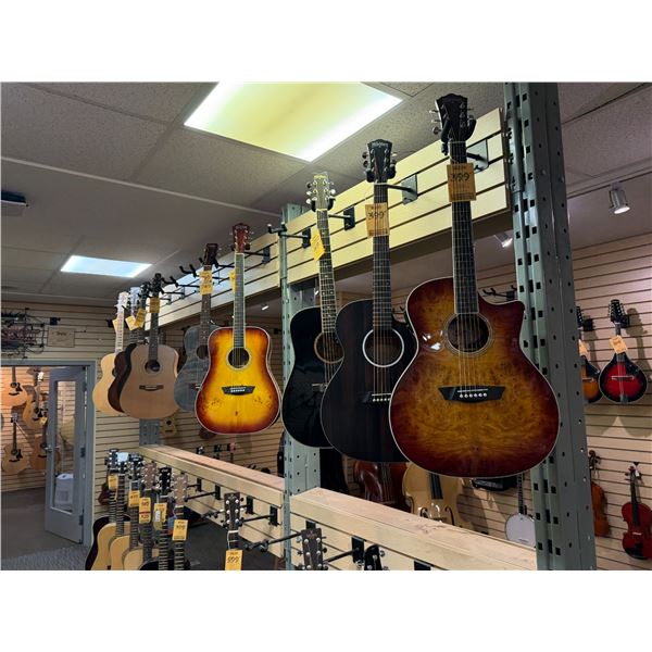 SAMPLE OF WHAT'S COMING — Acoustic guitars in an assortment of finishes and body styles.