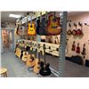 Image 2 : SAMPLE OF WHAT'S COMING — Acoustic guitars in an assortment of finishes and body styles.