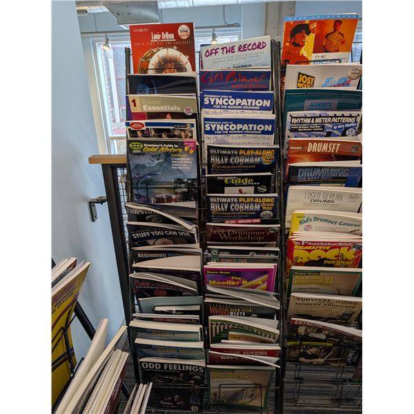 LOT OF +/- 50 DRUM BOOKS WITH MAGAZINE RACK
