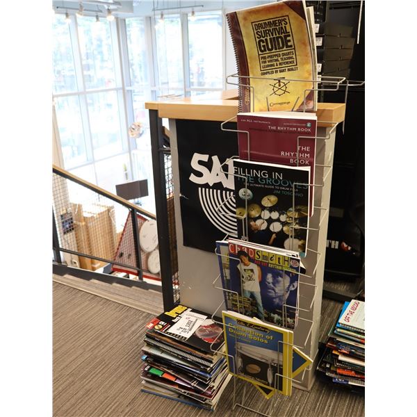 LOT OF +/- 50 DRUM BOOKS WITH MAGAZINE RACK