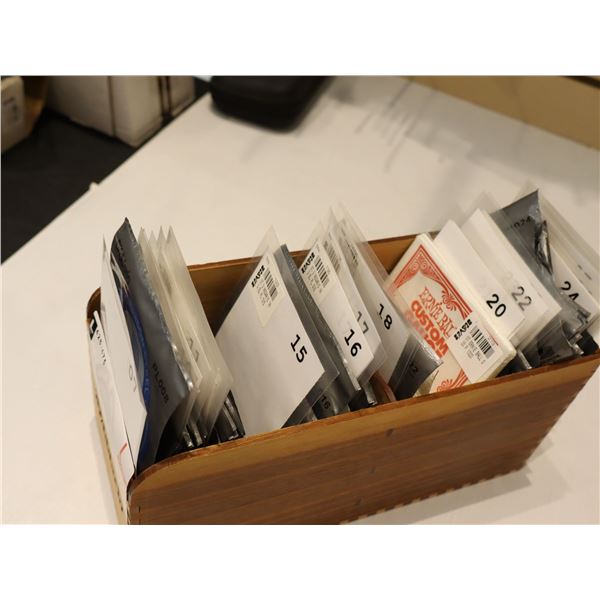 LOT OF INDIVIDUALLY PACKAGED GUITAR STRINGS (08-26) PLUS WOODEN D'ADDARIO BOX