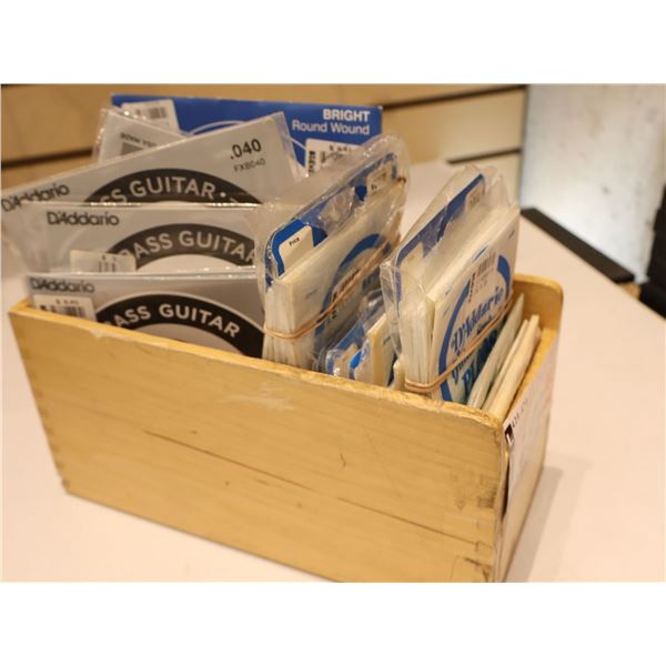 LOT OF INDIVIDUALLY PACKAGED BASS & MISC STRINGS PLUS WOODEN BOX