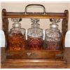 Image 1 : Wood And Brass Tantalus With Three Cut Glass Decanters