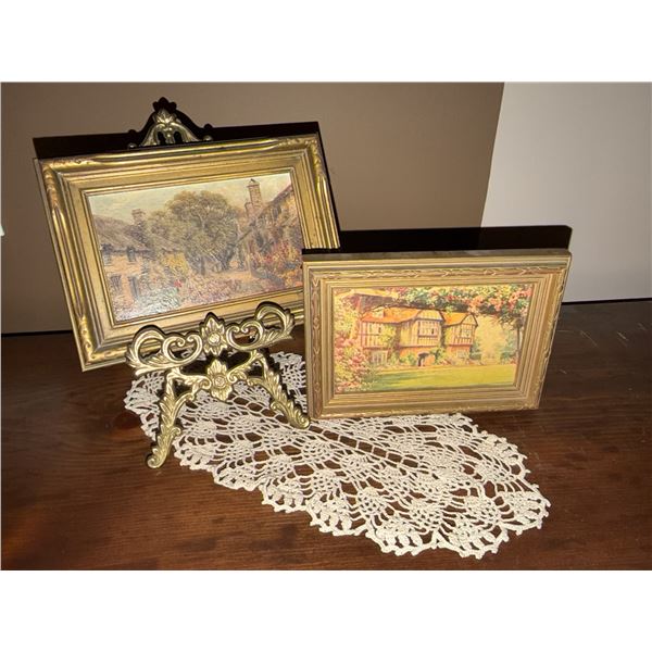 Framed Paintings, Brass Easel Stand, and Crocheted Doily