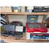 Image 4 : Contents of Shelf Including Tools, Fitness Weights, and Hardware