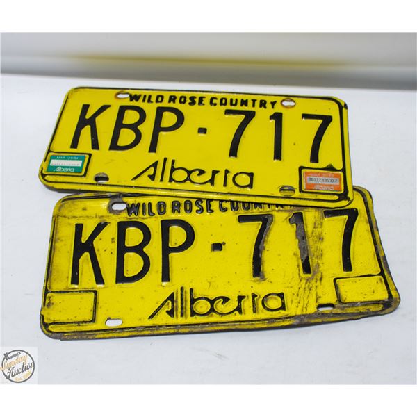 2 VINTAGE MATCHING YELLOW 70S ALBERTA LICENSE