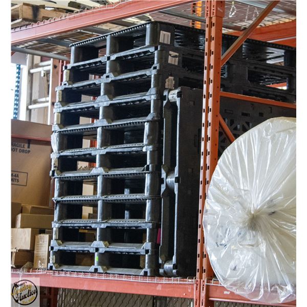 STACK OF 11 HEAVY DUTY PLASTIC PALLETS