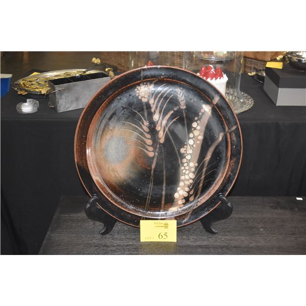 CERAMIC ART STONEWARE PLATE (SMALL CHIP) (18 3/4") (DOES NOT INCLUDE STAND)