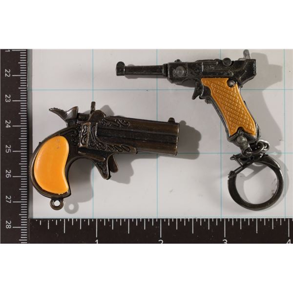 2 KEY CHAIN CAP GUNS. ONE IS 2.25" & ONE IS 2.5"