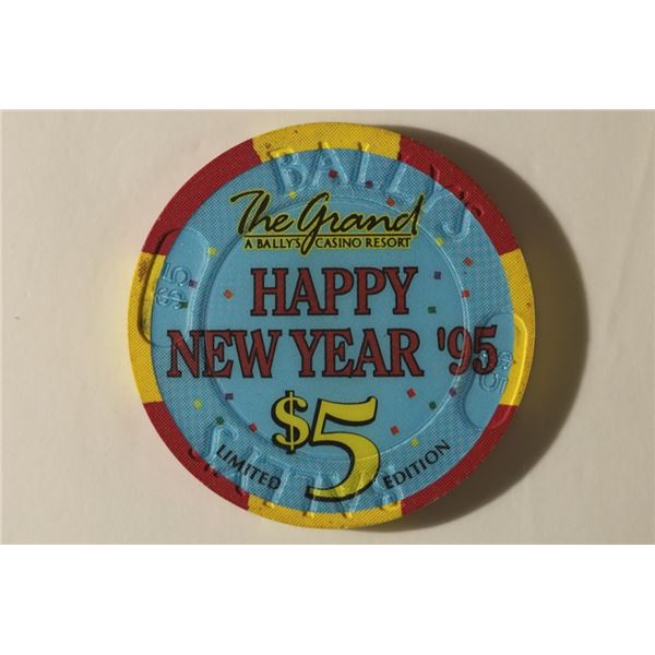 $5 THE GRAND CASINO CHIP. 1995 HAPPY NEW YEAR